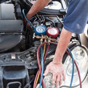certified-mechanic-replacing-car-ac-compressor-at-leos-towing-and-auto-repair-oceanside