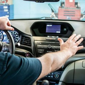 mechanic-diagnosing-car-ac-not-cold-with-full-refrigerant-at-oceanside-repair-shop